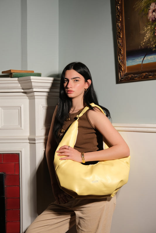 The croissant bag in butter yellow ( Leather )