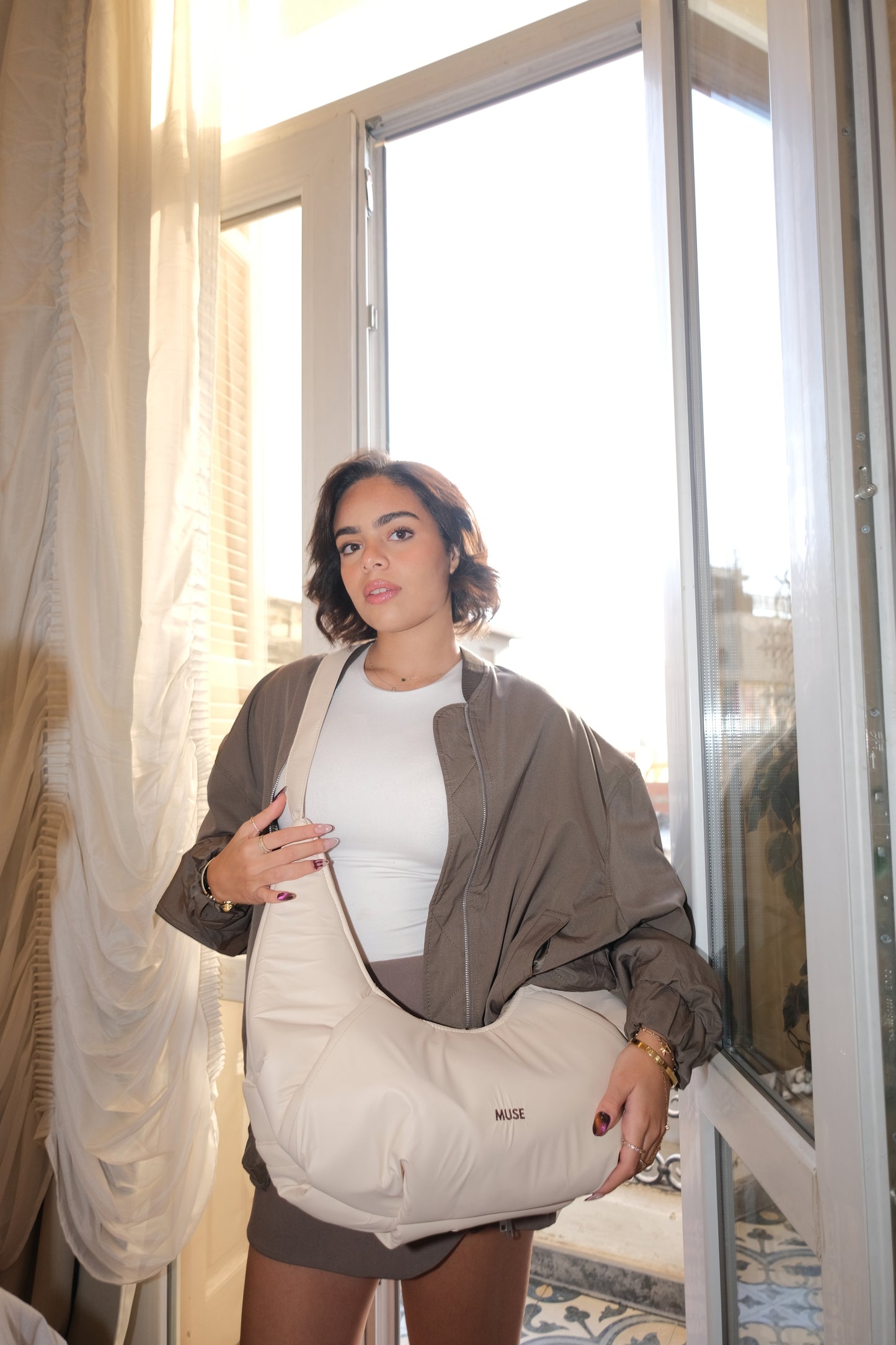 The croissant Bag in latte